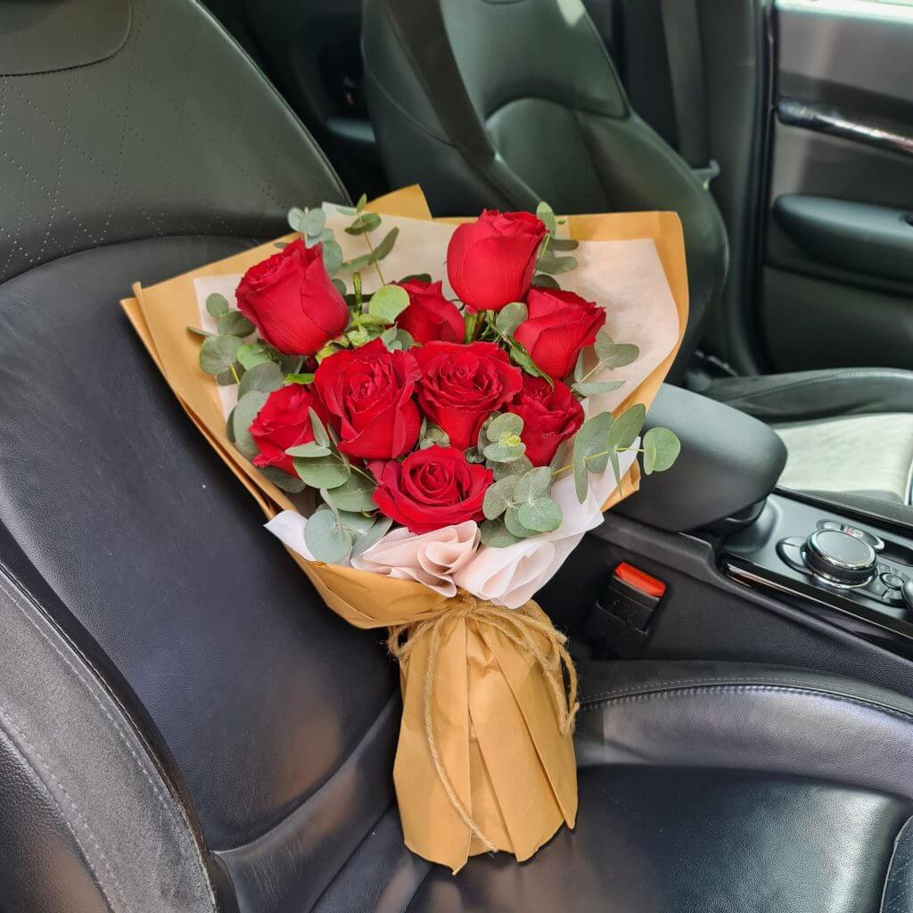 Majestic Roses Bouquet on a car seat
