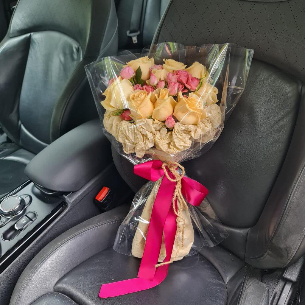 Bright and Cheerful Rose Bouquet in a Car
