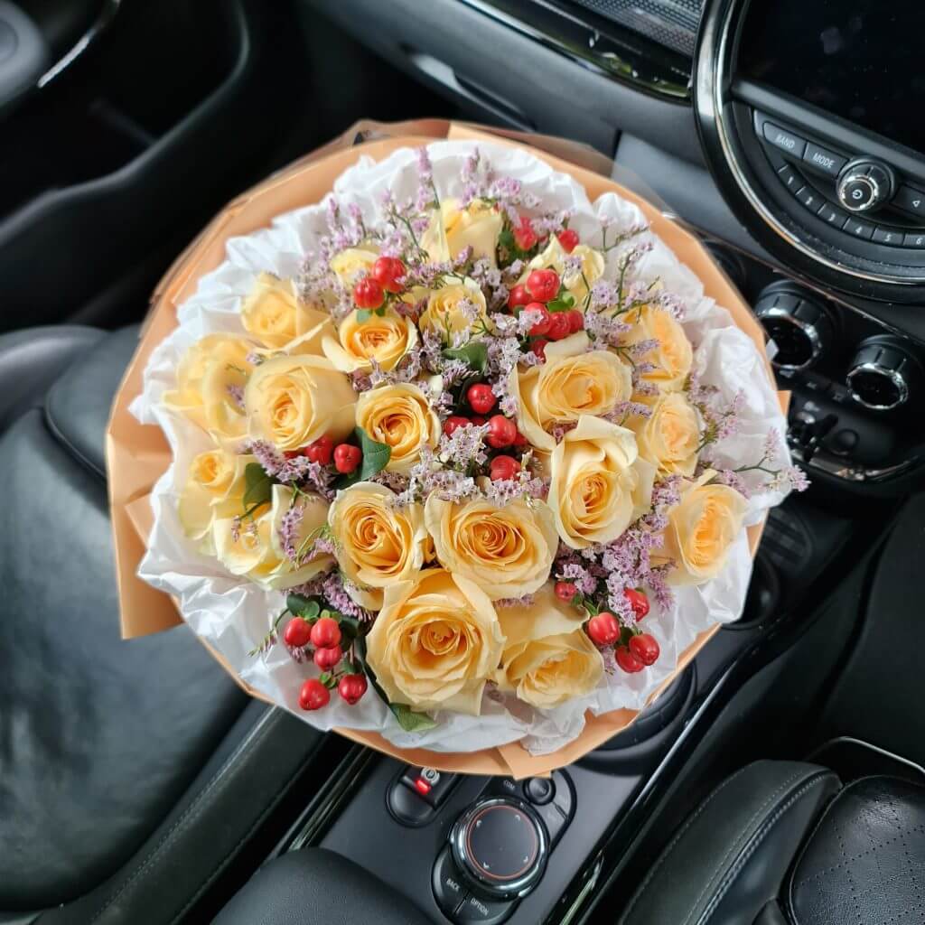 Bright and Cheerful Roses Bouquet In A Car