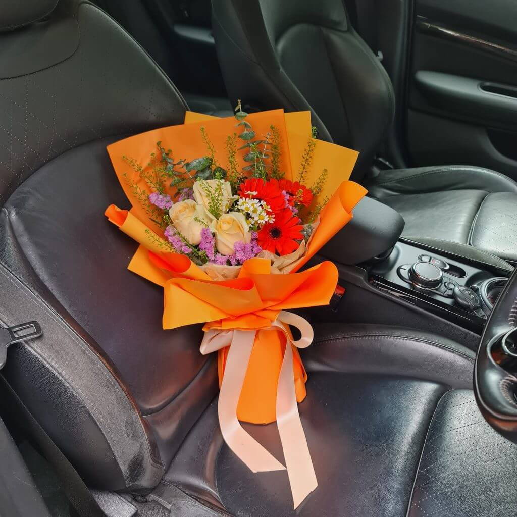 Garden Delight Bouquet on a car seat