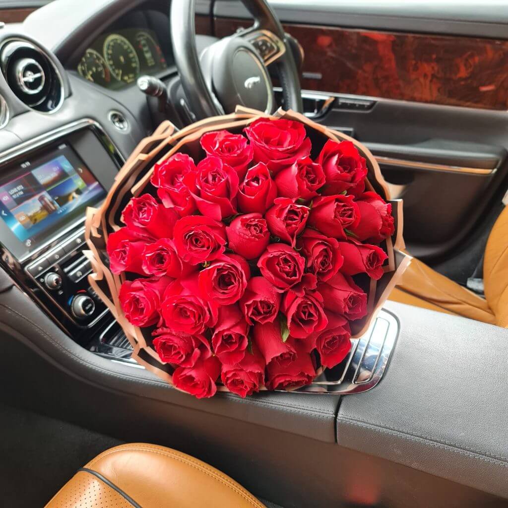 Pure Elegance Bouquet in a car