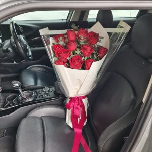 Romantic Red Roses Bouquet - A stunning arrangement of red roses in a car